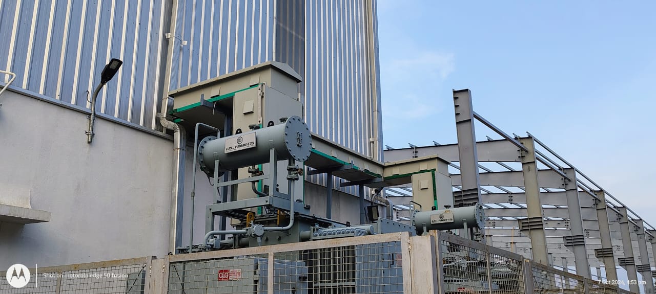 Transformer with cooling bank outside an industrial plant
